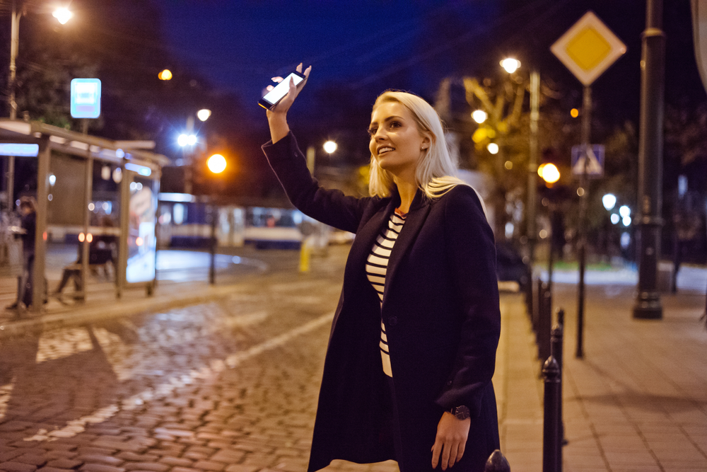 Photo of a Girl Waving at a Driver