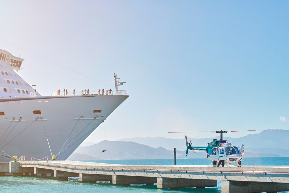 Emergency Helicopter In A Port Next To A Cruise Ship