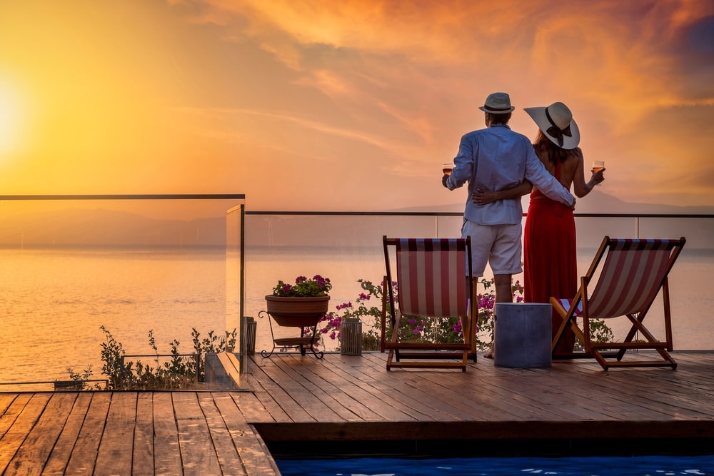 A Couple Enjoying The Sunset On A Cruise