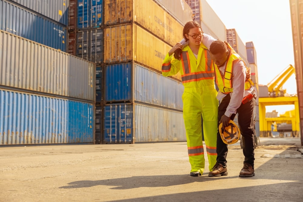 Dock Worker Carrying His Injured Colleague