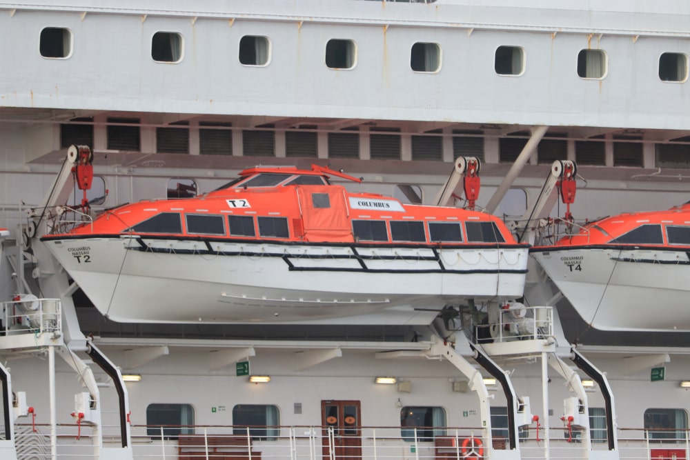 Tender Boat Hanging On The Side Of A Large Ship