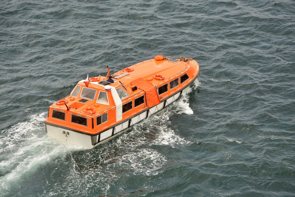 Orange Tender Boat On Water
